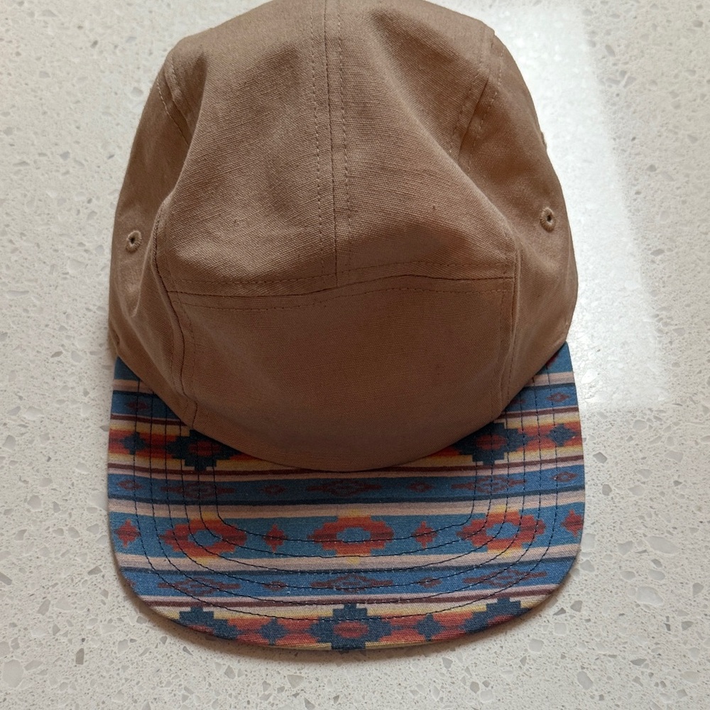 Storied hats tan and patterned cap